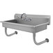 A stainless steel Advance Tabco multi-station wall mounted utility sink with a faucet.