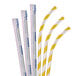 A close-up of three Aardvark yellow and white striped paper straws.