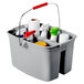A Rubbermaid gray plastic bucket with cleaning supplies in it.