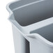 A close-up of a Rubbermaid gray divided bucket.
