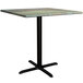 A Lancaster Table & Seating square table with a textured canyon metal surface and a cross base plate.