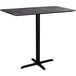A black rectangular Lancaster Table & Seating bar height table with a black cross base.