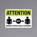 A black and yellow aluminum sign that says "Attention Maintain Proper Social Distancing" with images.