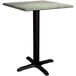 A Lancaster Table & Seating square dining table with a textured black metal base.