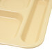 A white Carlisle 6 compartment tray with a tan surface.