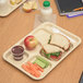 A Carlisle tan melamine 6 compartment tray with a sandwich, apple, and carrot.