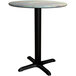 A Lancaster Table & Seating round table with a black base plate and textured metal top.