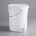 A white plastic round dispenser bucket with a handle and lid.