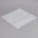 A white square plastic bag on a gray surface.