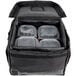 A black Vesture heavy-duty thermal catering bag with plastic containers inside.