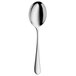 A WMF stainless steel vegetable serving spoon with a white handle.