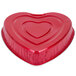 A red heart shaped foil bake pan with a lid.