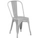 A gray metal Lancaster Table & Seating outdoor chair.