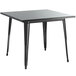 A black square Lancaster Table & Seating outdoor table with metal legs.