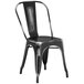 A black metal chair with a seat and back.