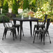 Lancaster Table & Seating Alloy Series 36" x 36" Black Dining Height Outdoor Table with 4 Industrial Cafe Chairs Main Thumbnail 1