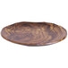 An Elite Global Solutions Sequoia wood grain melamine plate on a table.