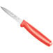 A Choice paring knife with a red handle.