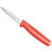 A Choice paring knife with a red handle.