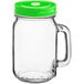 An Acopa glass drinking jar with a green metal lid.
