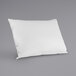 A white Protect-A-Bed pillow protector on a gray surface.