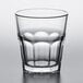 A Pasabahce Casablanca clear glass tumbler with a rounded bottom on a white table.