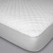 A white Protect-A-Bed mattress pad with a quilted surface.