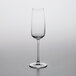 A clear Nude Mirage flute wine glass on a white background.