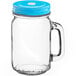 An Acopa clear glass drinking jar with a light blue metal lid.