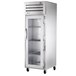 A white True Spec Series heated holding cabinet with glass doors and shelves.