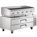 A Cooking Performance Group stainless steel chef base with three drawers.