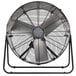 A large metal TPI industrial fan with metal legs.