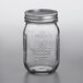 A Ball glass canning jar with a silver lid.