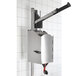 A Nemco stainless steel wall-mount pump dispenser with a handle.
