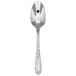 A close-up of a Oneida Ivy Flourish stainless steel teaspoon with a pattern on the handle.