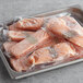 A tray of frozen salmon in plastic bags.