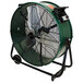 A large green King Electric industrial drum fan with black wheels.