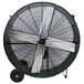 A large black King Electric industrial drum fan with wheels.