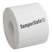 A roll of white TamperSafe paper labels with black text.