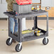 Lavex Industrial Large Black 2-Shelf Utility Cart with Flat Top, Built-In Tool Compartment, and Oversized Wheels Main Thumbnail 1