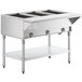 A large stainless steel ServIt natural gas steam table with three open wells on a counter.
