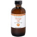 A bottle of LorAnn Oils All-Natural Orange Super Strength Flavor on a store counter.