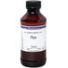 A close-up of a LorAnn Oils 4 fl. oz. bottle of plum flavoring liquid.
