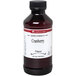 A close-up of a LorAnn Oils 4 fl. oz. bottle of cranberry flavor.