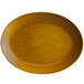 A yellow oval porcelain platter with a brown rim.