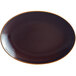 A brown oval RAK Porcelain platter with a white center.