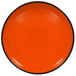 An orange RAK Porcelain deep plate with a black rim.