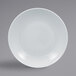 A RAK Porcelain bright white deep coupe porcelain plate with food on it.
