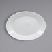 A RAK Porcelain bright white oval deep porcelain plate with an embossed circular pattern on a gray surface.