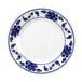 A white Thunder Group round melamine plate with blue flowers and a blue and white design.
